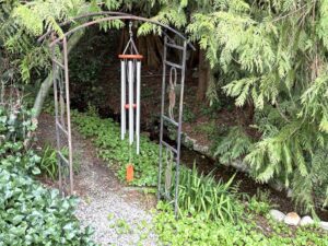 Beautiful Amazing Grace wind chime by creek
